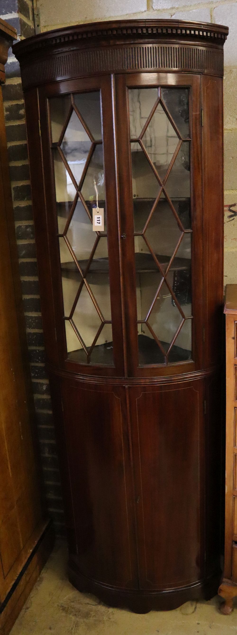 An Edwardian mahogany and boxwood-strung bow-fronted glazed corner cabinet, width 68cm depth 45cm height 208cm
